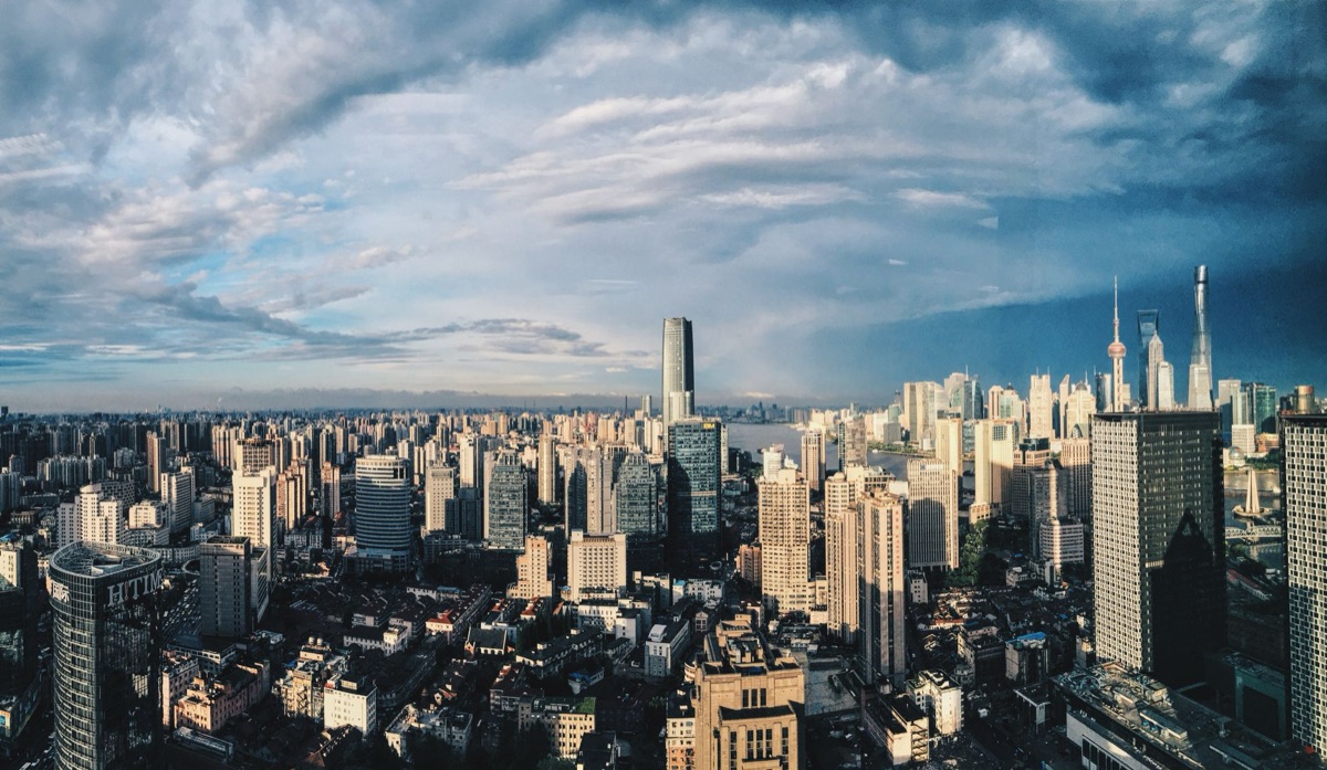 Modern Shanghai skyline with glass towers and bustling streets