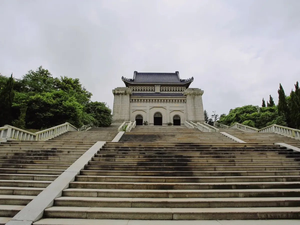 Majestic view of Dr. Sun Yat-sen's Mausoleum surrounded by greenery in Nanjing.
