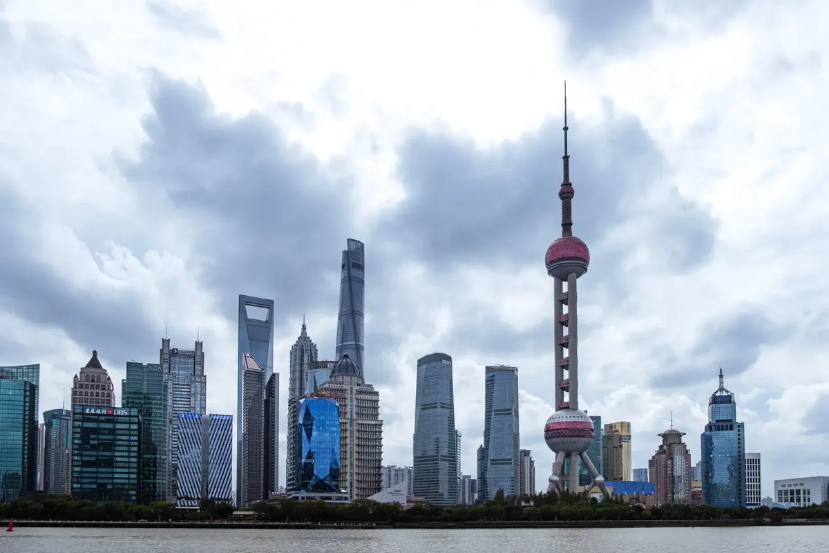 Dramatic skyline of Shanghai featuring iconic skyscrapers and the Oriental Pearl Tower.